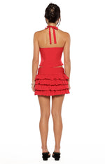 Rear view of the red chiffon polka dot halter neck top showing the tie-back halter and cutouts at the waist