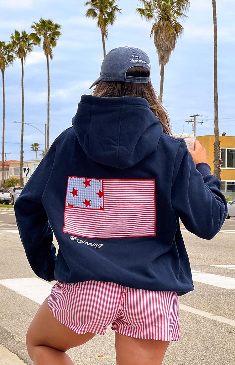 Beginning Boutique Beginning Navy USA Hoodie navy relaxed fit hoodie with a large US flag patch on the back and 'Beginning' embroidery