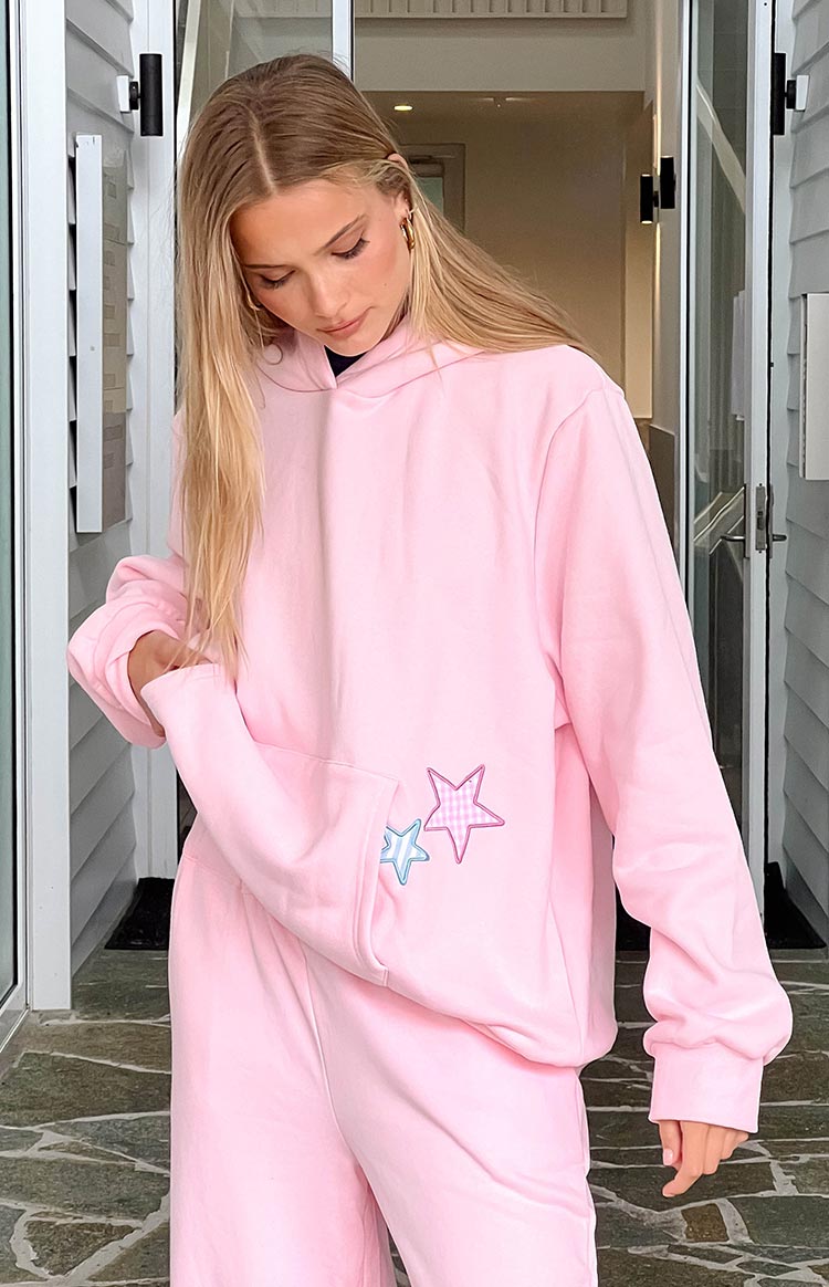 Beginning Boutique Beginning Pink Star Hoodie oversized pink long sleeve hoodie with hood, front pocket, and pink and blue gingham star patches