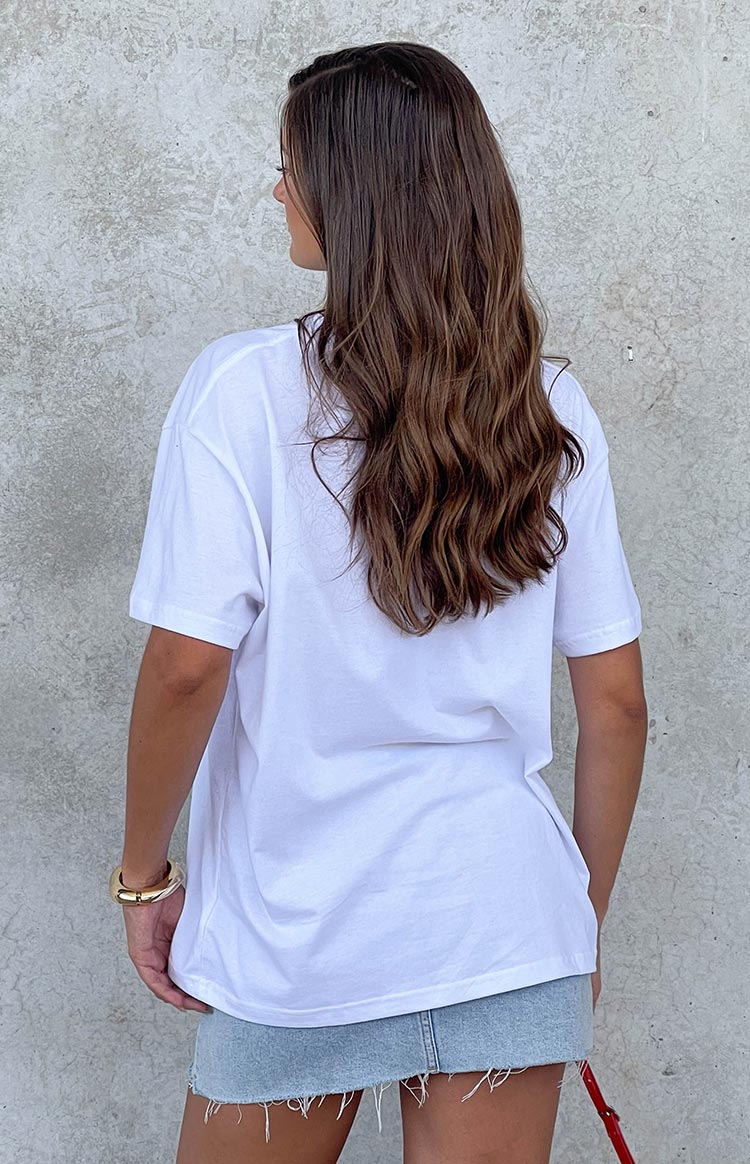 Rear view of a white oversized short sleeve tee with a relaxed fit