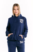 A navy blue outerwear consisting of a hooded sweatshirt best pair with wide-leg pants both featuring a white number 10 with a cow print pattern.