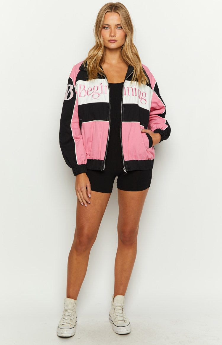 Front view of a pink black and white colour block bomber jacket with 'Beginning' text, full zip, and ribbed cuffs