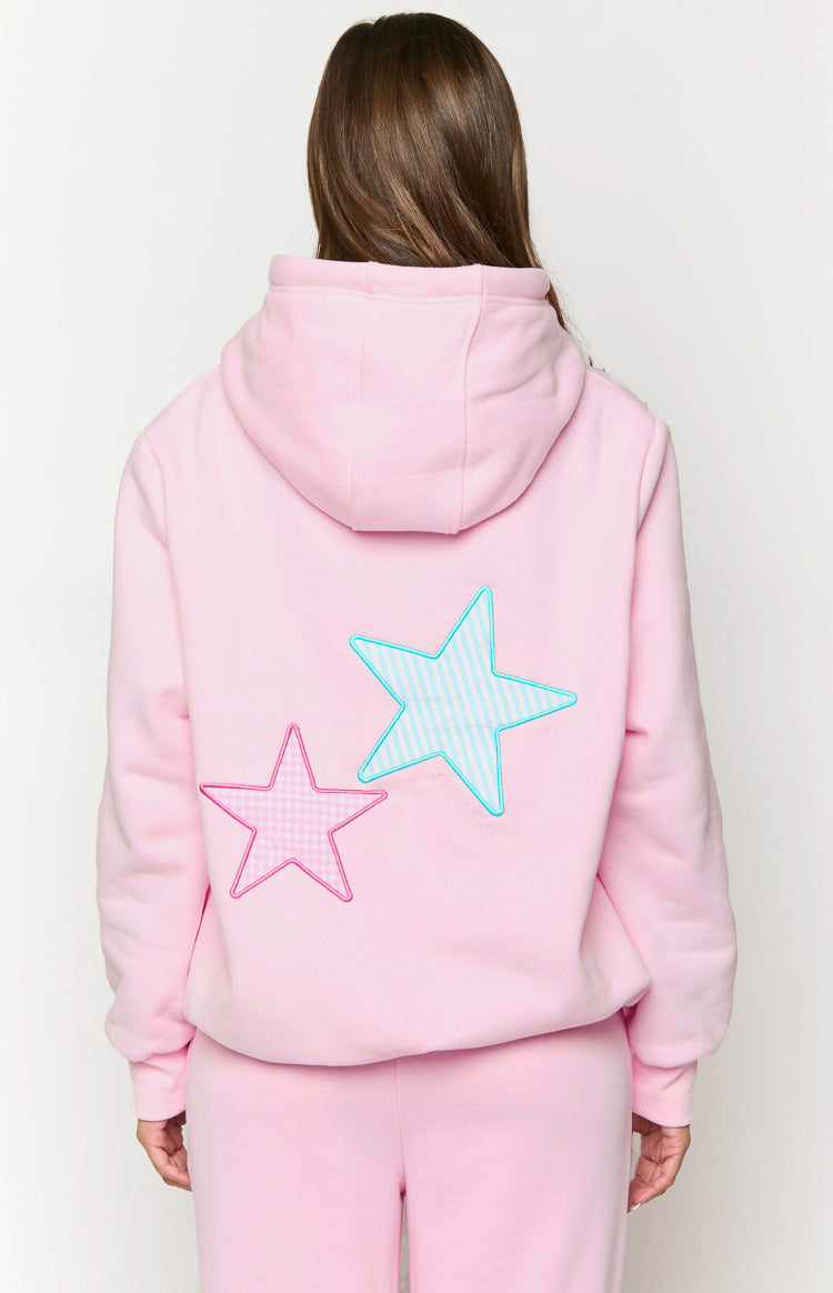 Rear view of a pink hoodie with a pink gingham star and a blue striped star applique on the back