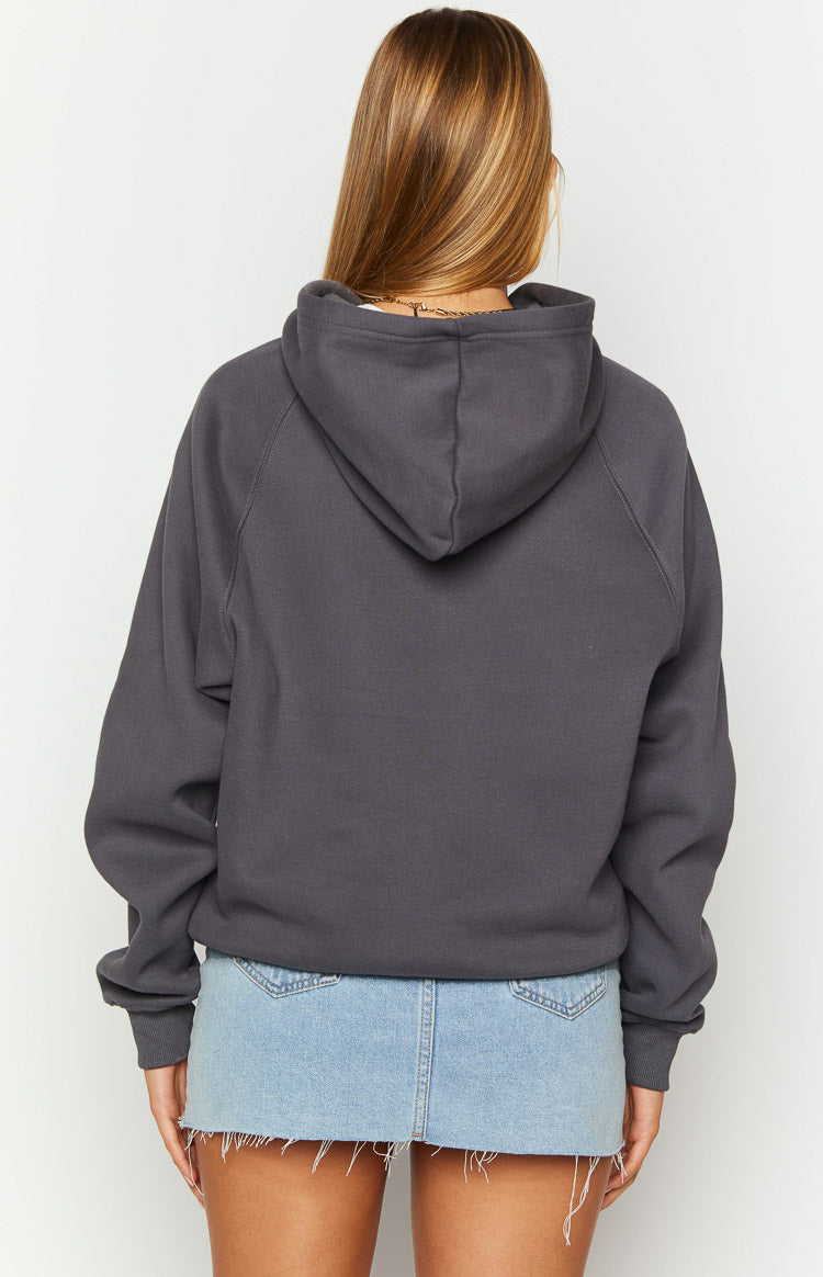 Rear view of a slate grey relaxed fit hoodie with a hood, raglan sleeves, and ribbed cuffs
