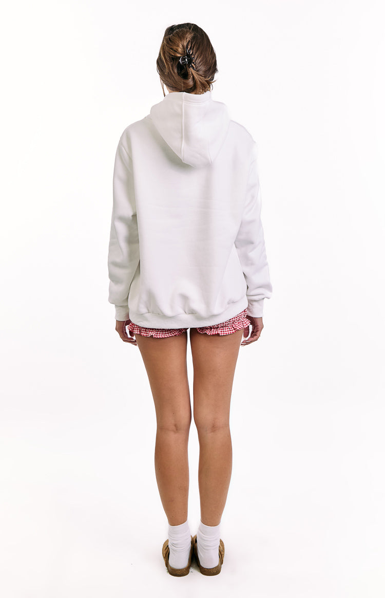 Rear view of a white hoodie with a relaxed fit, featuring a hood and an elasticated hem