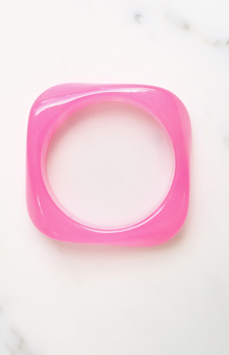 Beginning Boutique Bernie Pink Resin Bangle pink translucent resin bangle with a square outer shape and rounded corners