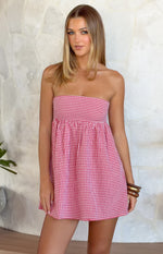 Red gingham strapless mini dress with a gathered empire waist and relaxed A-line skirt
