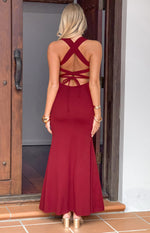 Rear view of a wine crepe maxi dress with criss-cross back straps and tie detail