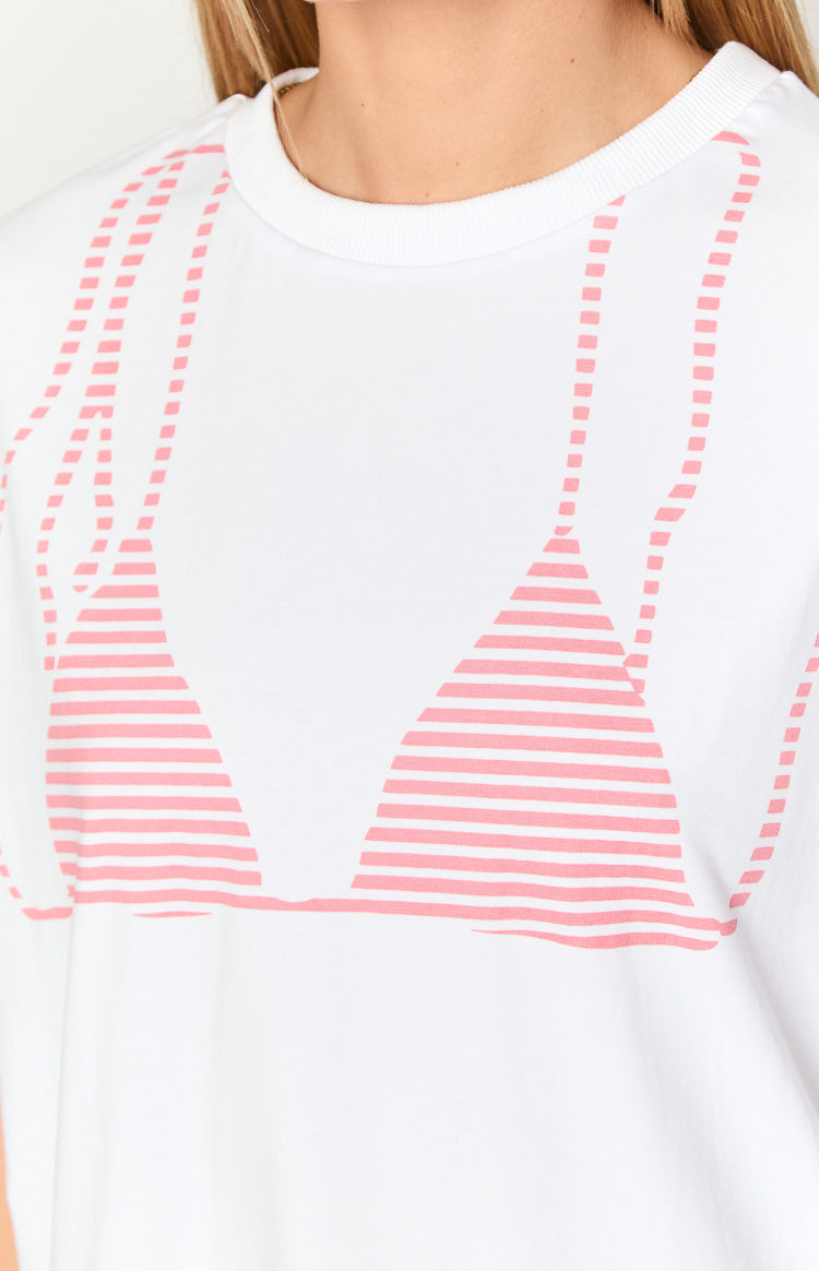 Close-up of the white tee's pink striped bikini graphic print with dashed straps
