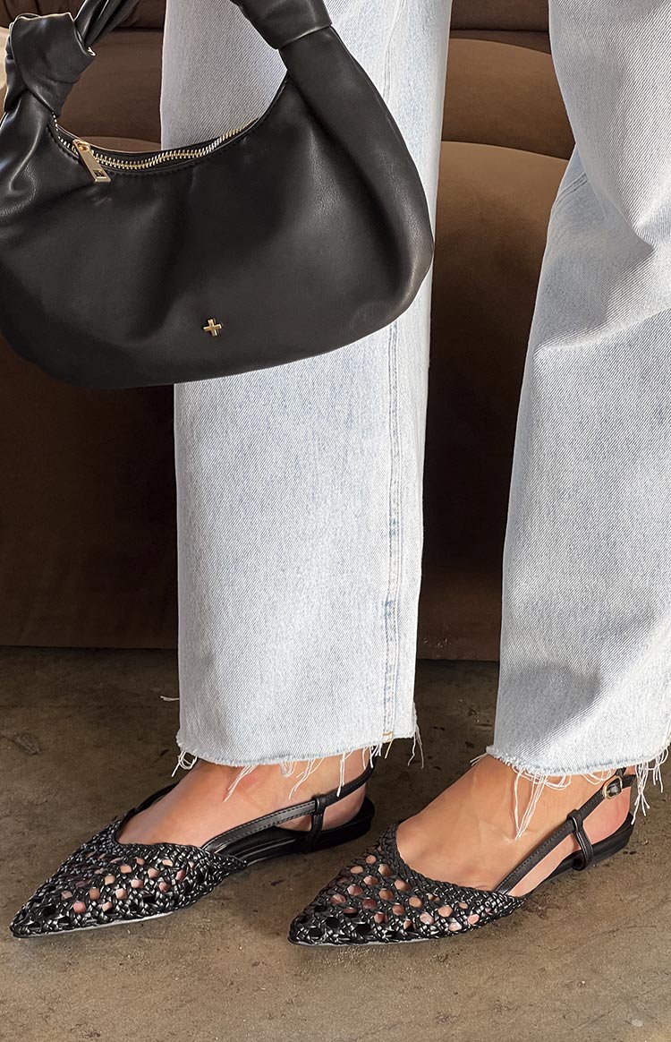 Black woven pointed-toe flat shoes with a slingback strap
