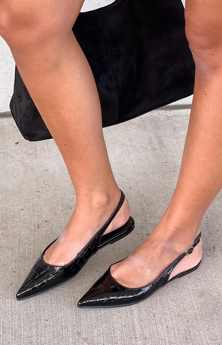 Black patent croc pointed toe shoe with a thin slingback strap and buckle