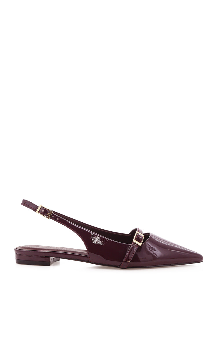Side view of a mulberry patent mule with a pointed toe, flat heel, and two gold buckle straps