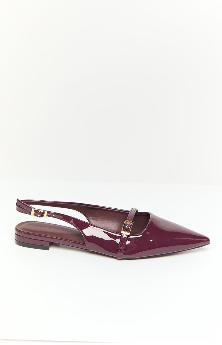 Side view of a mulberry patent mule with a pointed toe, slingback strap, and vamp strap with gold buckles
