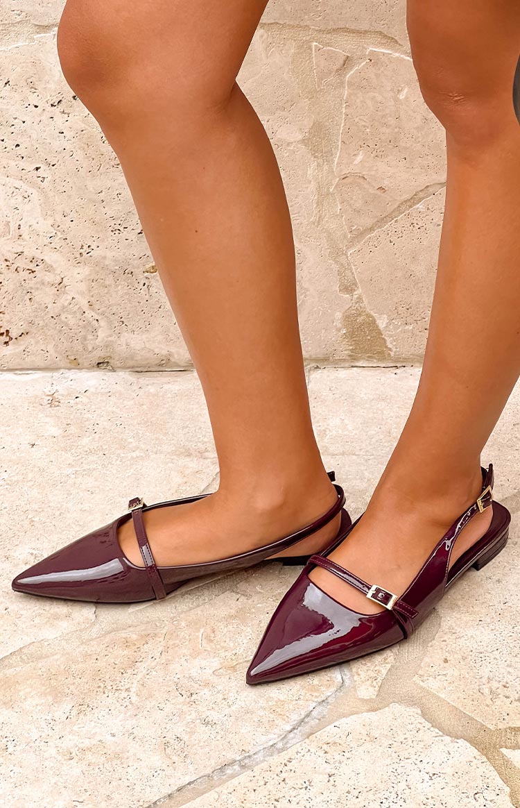 Mulberry patent pointed toe mules with a strap across the foot and a slingback