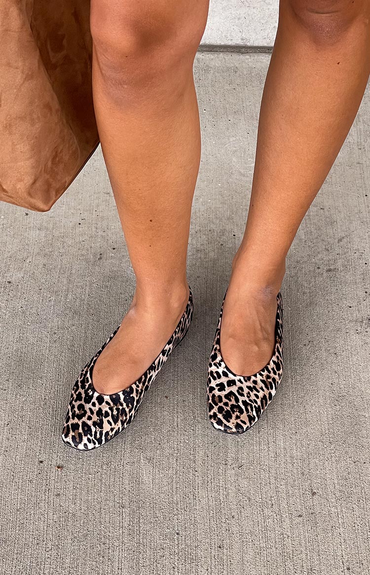 Overhead view of leopard print ballet flats with square toes and a low vamp