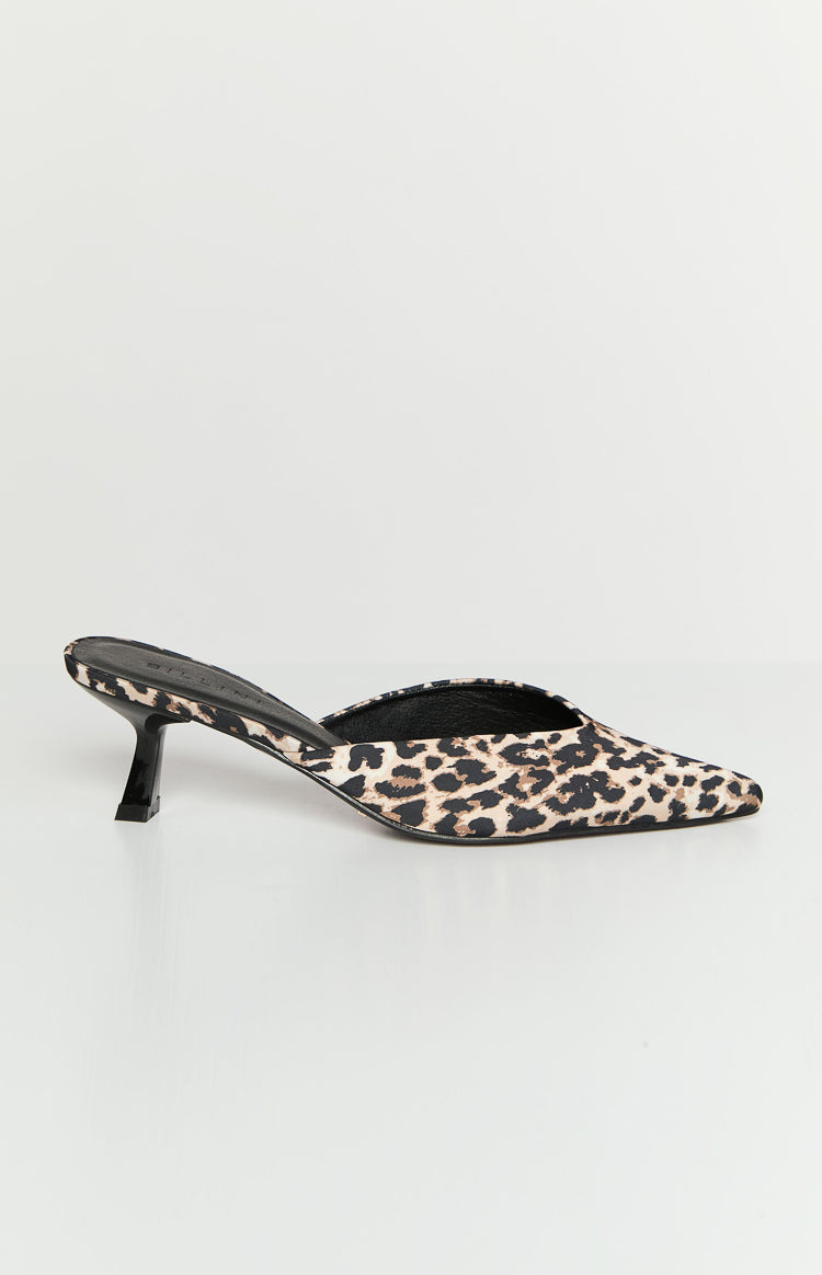 Side profile of a leopard print mule heel with a sharp pointed toe and a black flared kitten heel