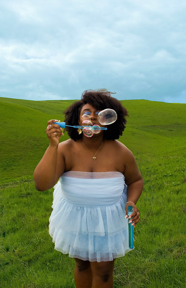 Light blue strapless mini dress with a bandeau bodice and a tiered ruffled tulle skirt