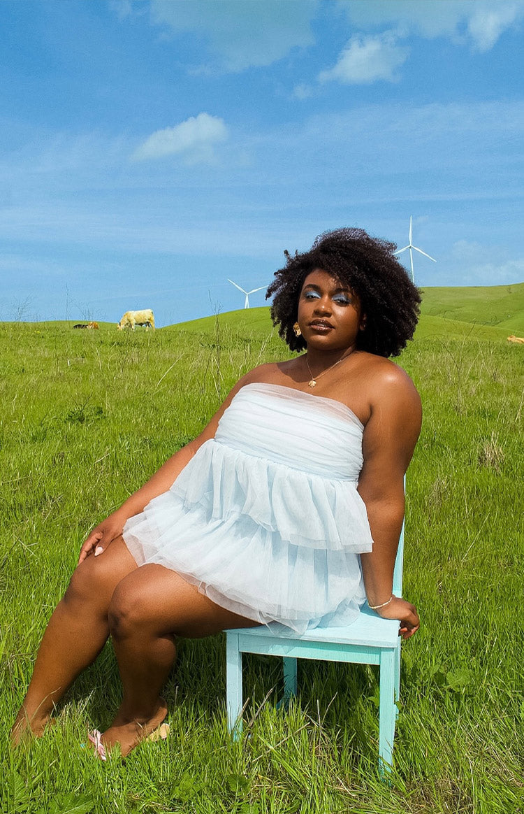 Baby blue strapless mini dress with a gathered bodice and a voluminous tiered tulle skirt