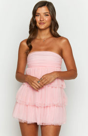 Pink strapless mini dress featuring a ruched tulle bust and multiple layers of ruffled tulle on the skirt