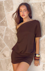 Brown off-shoulder mini dress with a relaxed fit top, short sleeve, and blouson waist