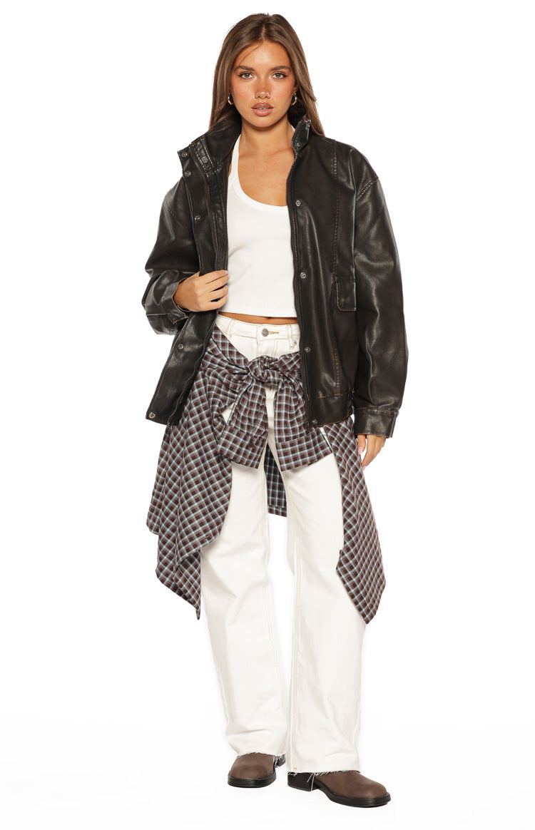 Front view of the brown PU funnel neck jacket, worn open, highlighting its oversized fit and visible stitching