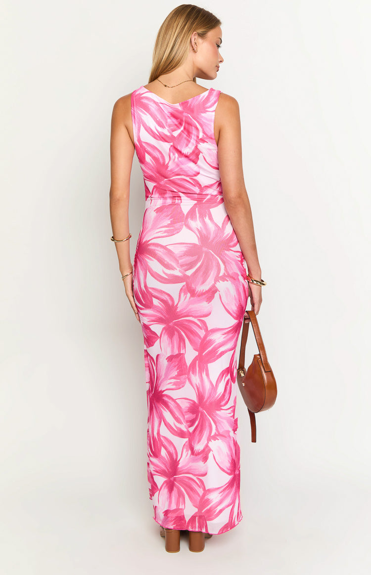 Rear view of a fitted pink floral maxi dress with a scoop back and ruched side detail