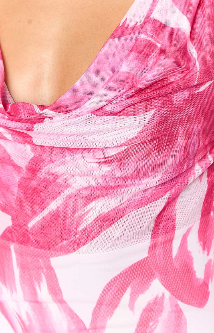 Close-up of the draped cowl neckline and sheer pink and white floral mesh fabric on the maxi dress