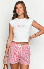 Close-up of the red and white vertical striped boxer shorts with an elasticated waistband