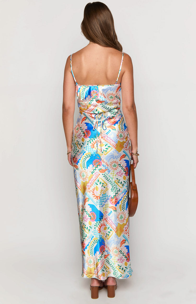 Rear view of the colourful abstract print satin maxi dress, featuring thin spaghetti straps and an adjustable tie-back detail at the waist