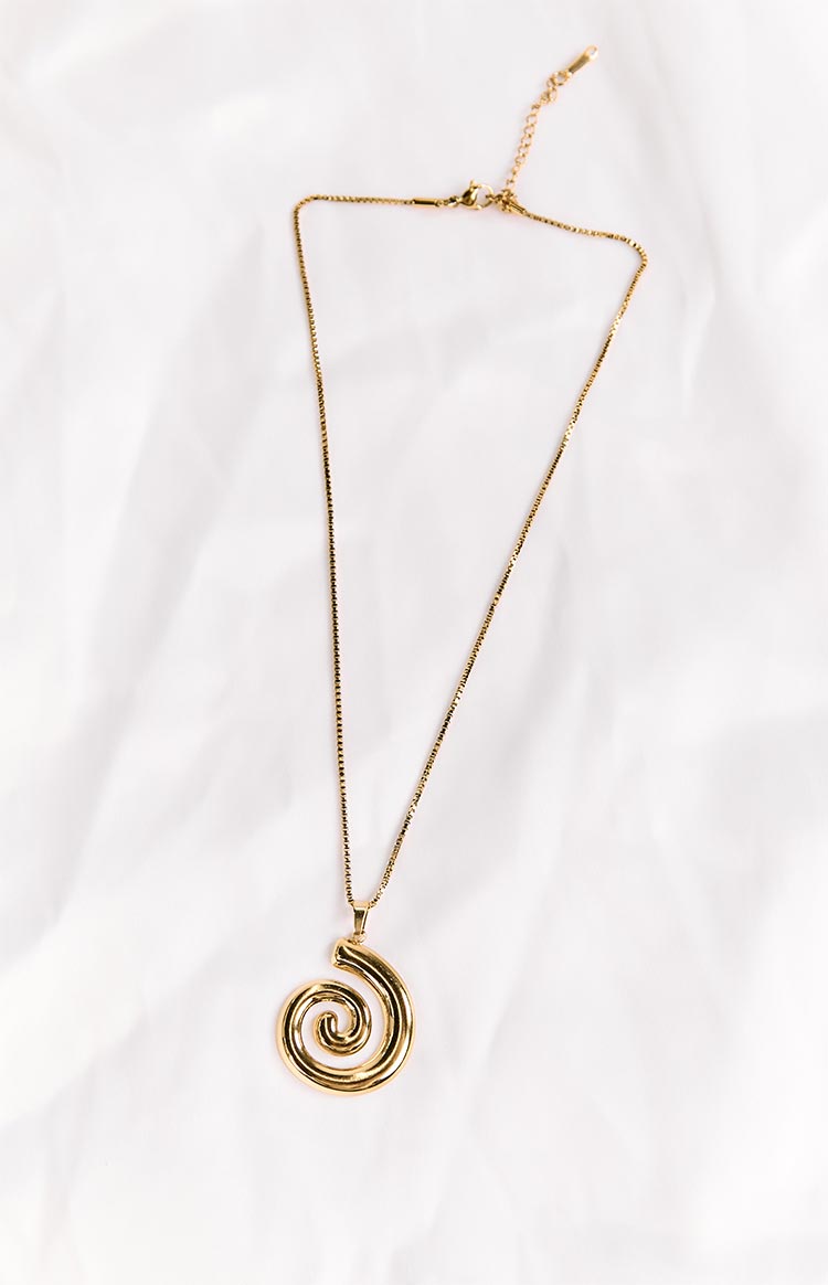 Gold necklace with a spiral pendant, box chain, and adjustable lobster clasp closure