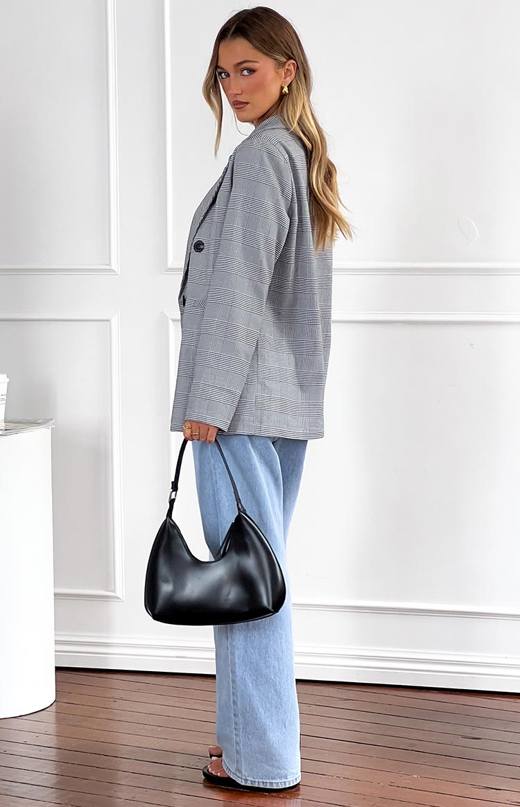Side view of light wash mid-rise slouchy jeans with a wide leg and relaxed fit
