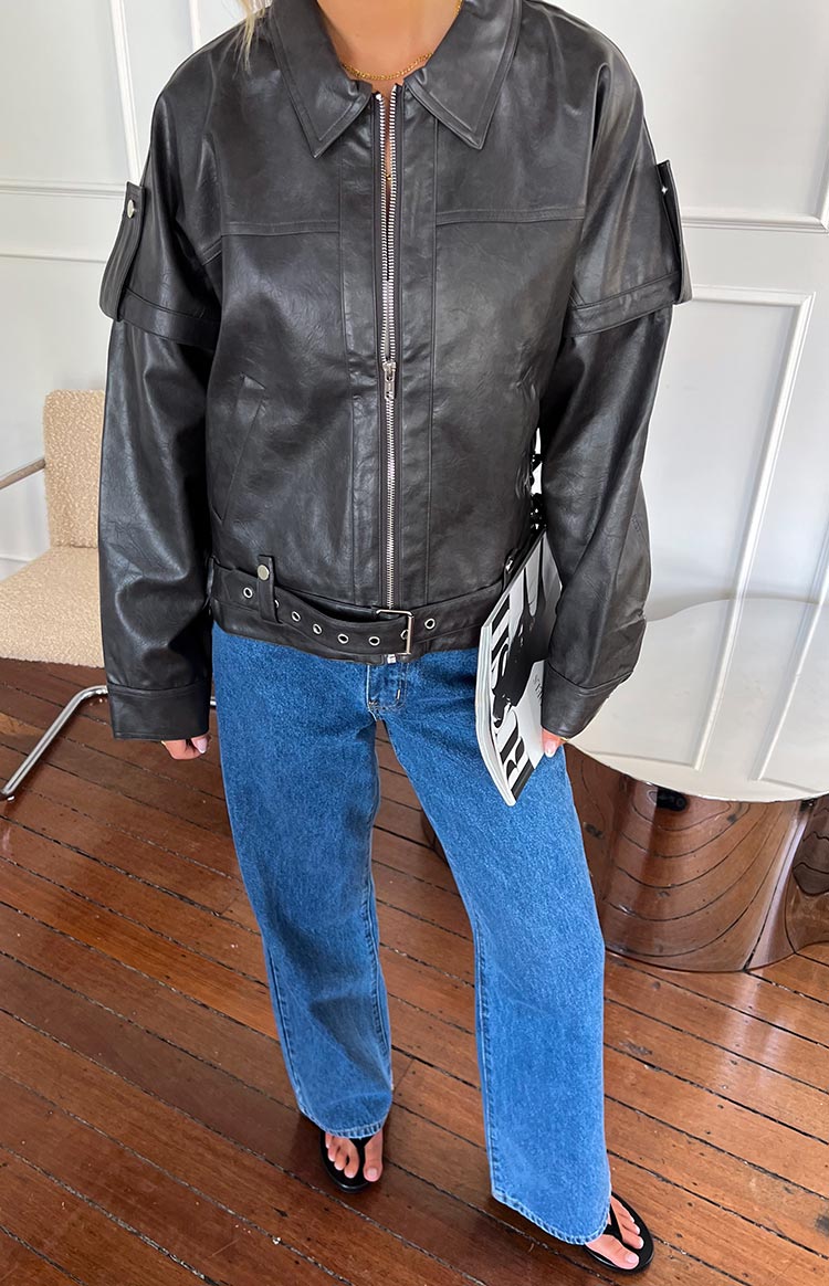 Mid wash blue mid rise slouchy jeans with a wide leg fit