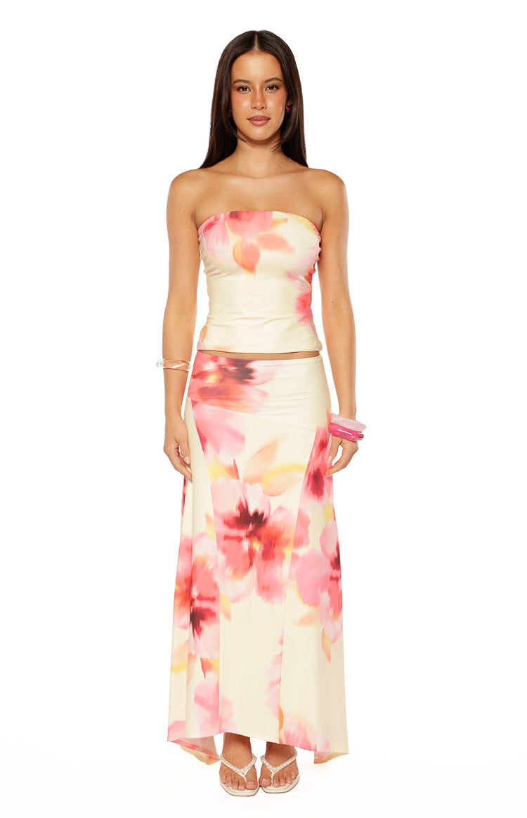 Front view of a yellow and pink floral print strapless tube top with a fitted silhouette