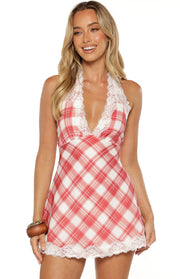 Front view of a red and white plaid mini dress with a deep V-neckline, white lace trim, and halter neck