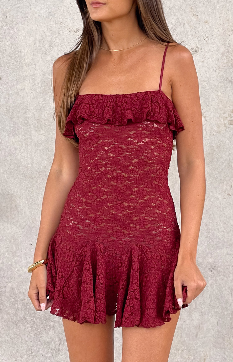 Wine lace mini dress with a textured pattern, ruffled bodice overlay, and a flared mini skirt