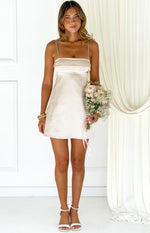 Cream satin mini dress with a straight neckline, draped bust detail, and thin spaghetti straps