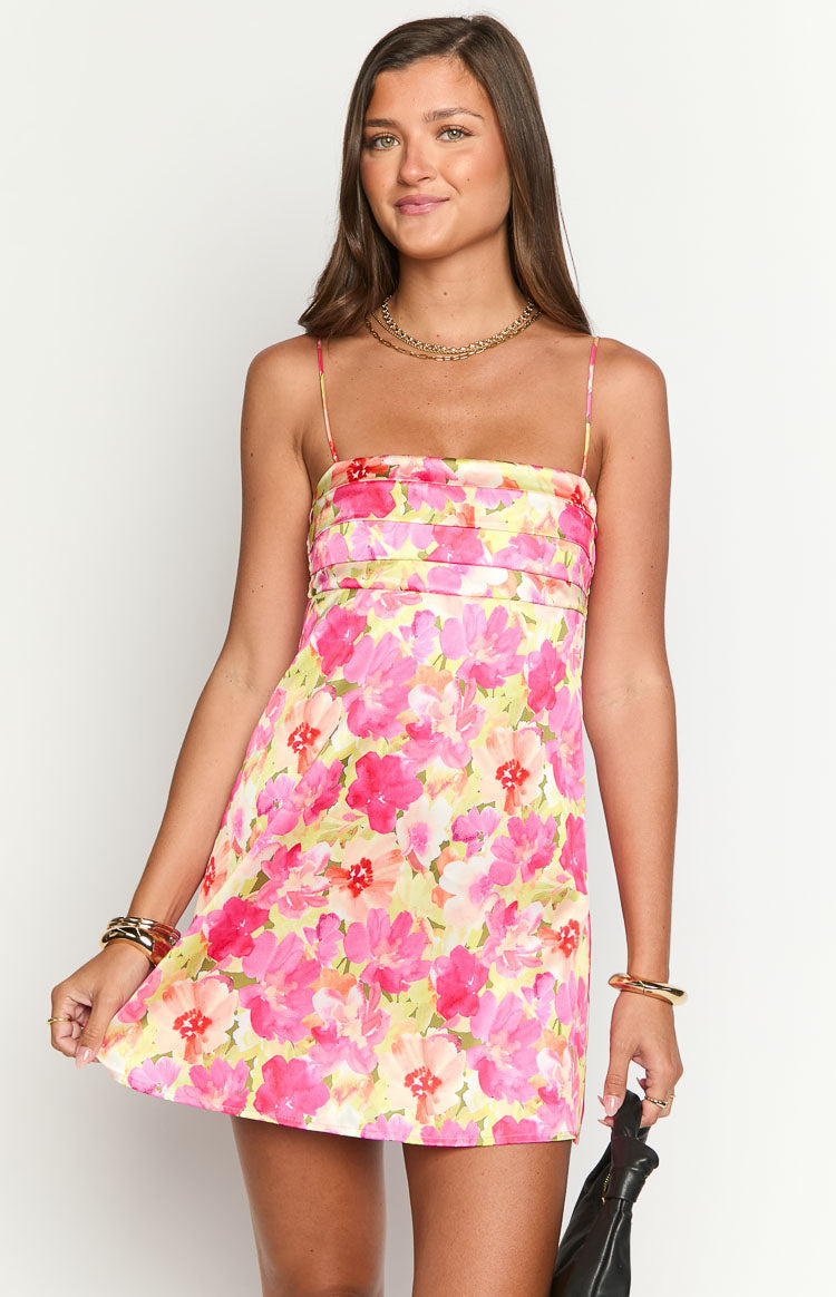Vibrant yellow and pink floral mini dress with a square neckline, thin spaghetti straps, and a ruched bodice
