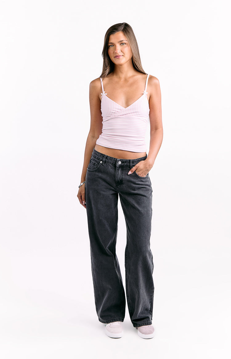 Front view of black low waist baggy leg jeans with a relaxed fit and visible front pockets