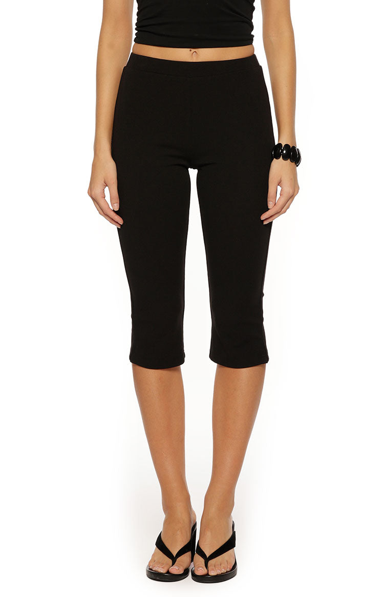 Beginning Boutique City Lights Black Jersey Capri Pants black jersey fitted high-waisted capri pants with an elastic waistband