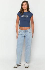 Full length view of light wash denim low rise jeans with a relaxed wide-leg silhouette and subtle fading