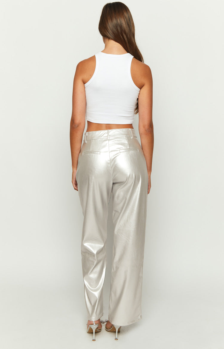 Rear view of metallic silver wide-leg pants with a high waist and two flat back pockets
