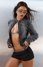 Partially unzipped black washed denim biker jacket with a band collar and cropped fit