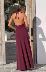 Rear view of a burgundy crepe maxi dress with a halter neck tie and open back, showing the zipper closure