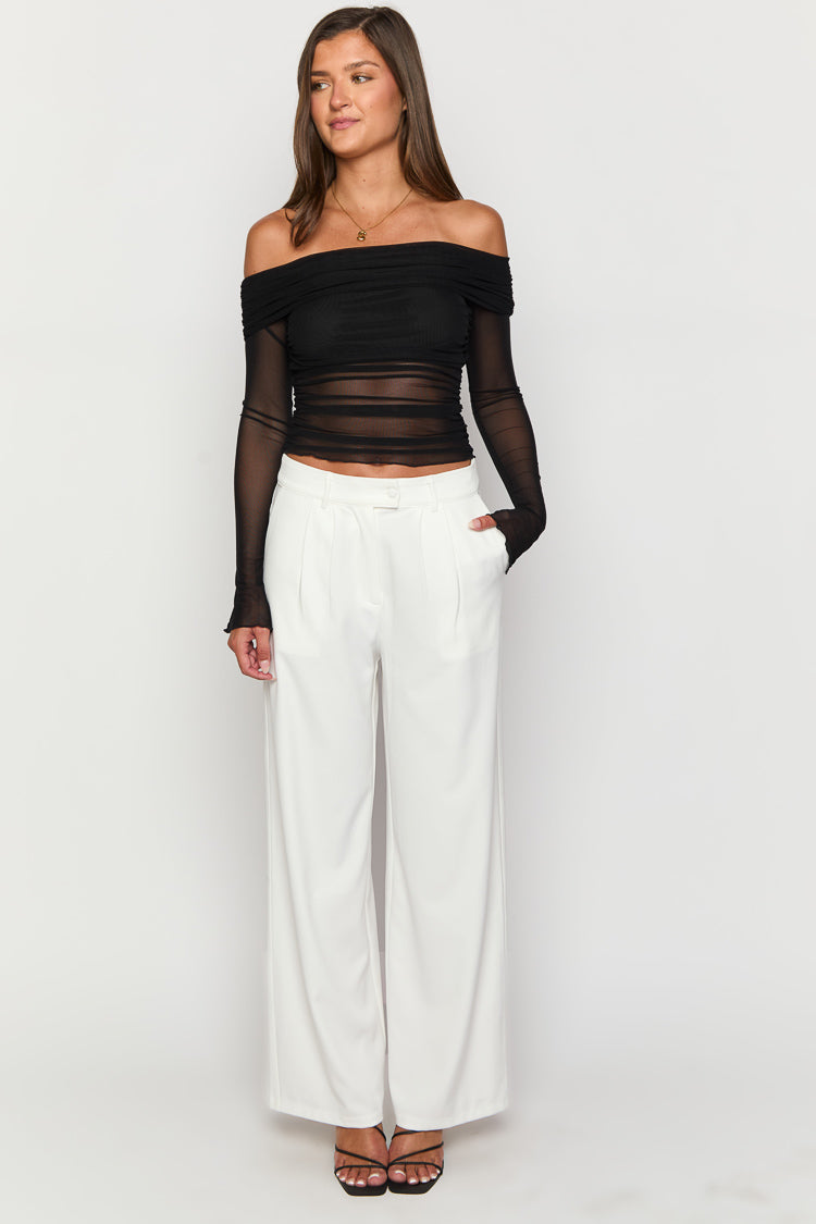 Full length view of white tailored wide-leg pants with front pleats and a single button closure