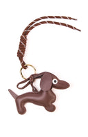 The Dachshund Braided Bag Charm in a chocolate brown colour a cute accessory to add personality to any handbag or purse.