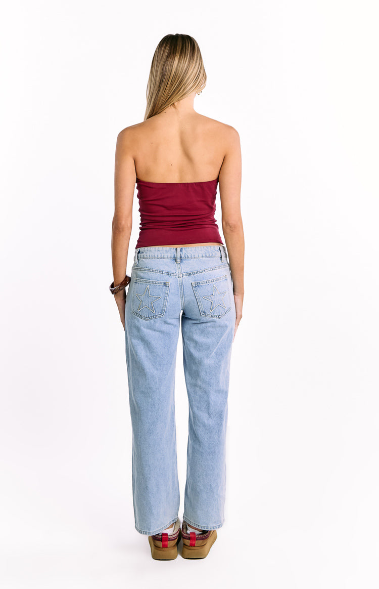 Rear view of the fitted burgundy strapless top with a straight back neckline