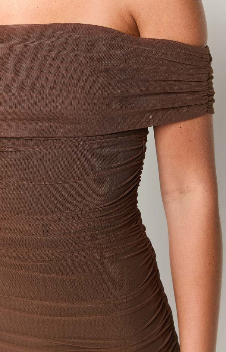 Close-up of the brown mesh off-shoulder neckline and ruched detailing on the side of the mini dress