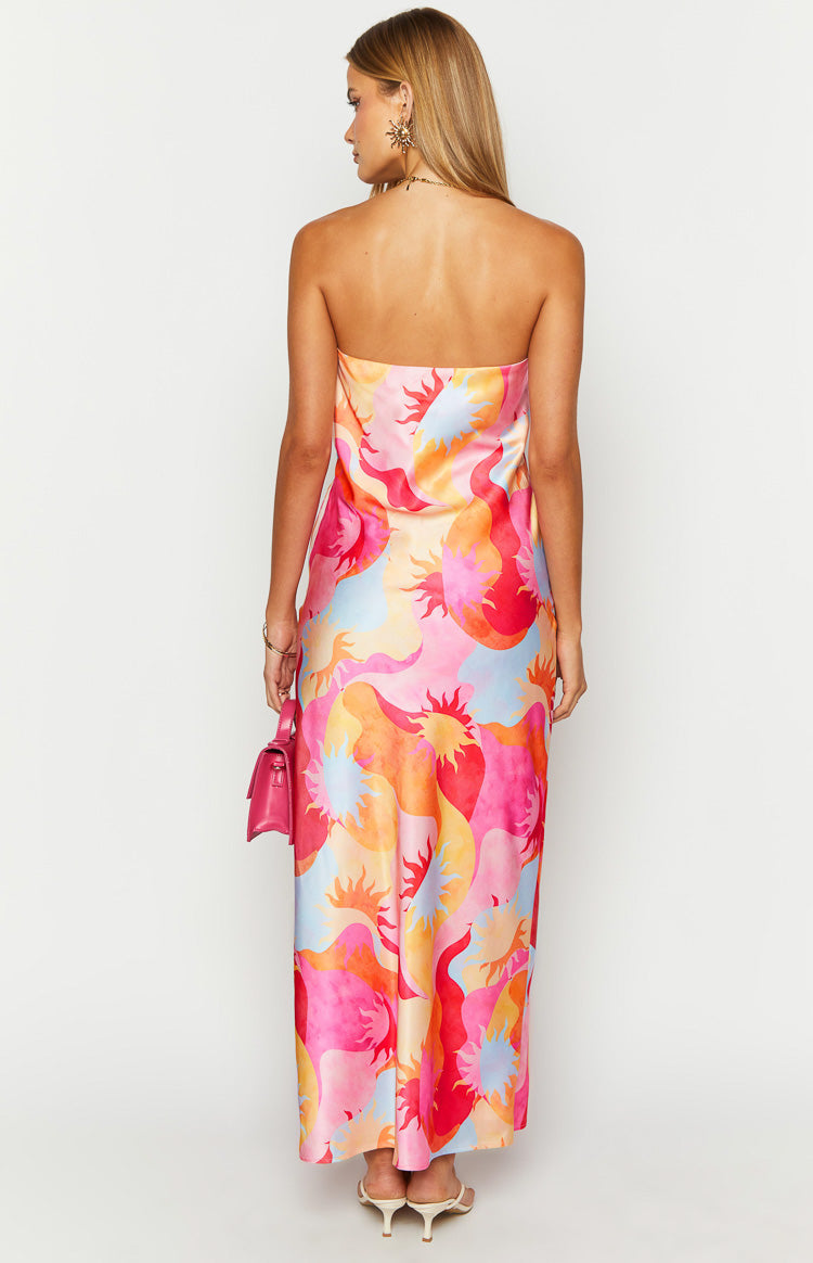 Rear view of the strapless maxi dress with a straight back neckline and vibrant pink orange and blue sun print