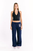 A matching navy blue loungewear   wide-leg sweatpants with a large white number 10 graphic.