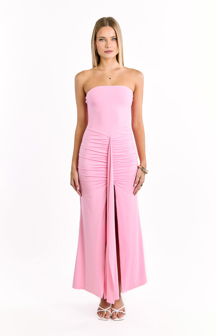 Pink strapless maxi dress with a fitted bodice, ruched front detail, and a high central slit